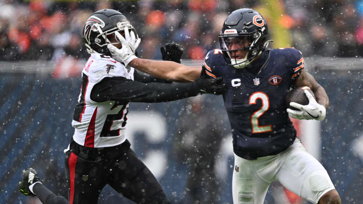 DJ Moore stiff-arms A.J. Terrell last season in a Bears win over Atlanta. Moore and their explosive receiver group are winning over critics.