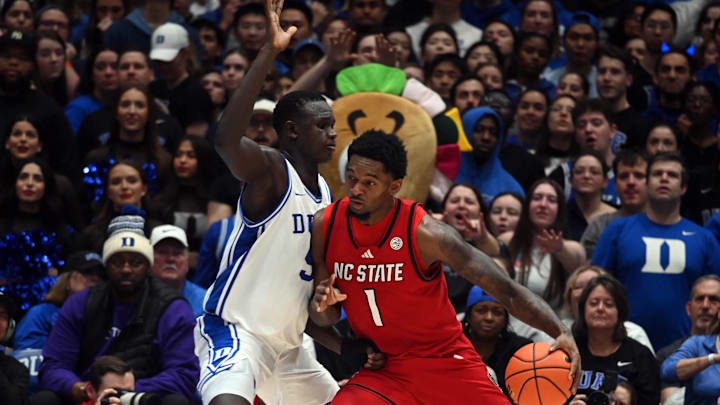 Jan 27, 2025; Durham, North Carolina, USA; North Carolina State Wolfpack forward Brandon Huntley-Hatfield (1) drives against Duke Blue Devils center Khaman Maluach (9) during the second half at Cameron Indoor Stadium. The Blue Devils won 74-64. Mandatory Credit: Rob Kinnan-Imagn Images Jan 27, 2025; Durham, North Carolina, USA; North Carolina State Wolfpack forward Brandon Huntley-Hatfield (1) drives against Duke Blue Devils center Khaman Maluach (9) during the second half at Cameron Indoor Stadium. The Blue Devils won 74-64. Mandatory Credit: Rob Kinnan-Imagn Images