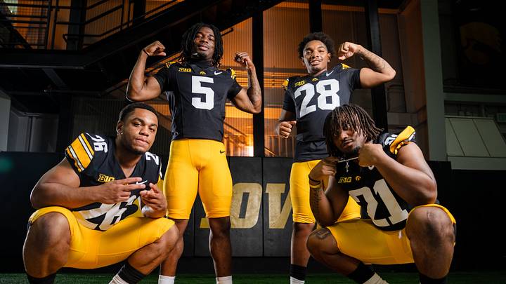 Iowa running back Xavier Williams (26) Iowa running back Nathan McNeil (5) Iowa running back Kamari Moulton (28) and Iowa running back L.J. Phillips Jr. (21) stand for a portrait during Hawkeye football media day, Friday, Aug. 14, 2026, in Iowa City.
