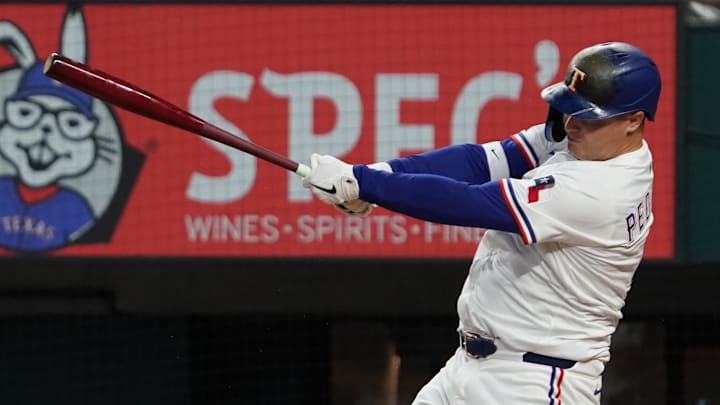Texas Rangers first baseman Joc Pederson (4) hits a single during the fifth inning against the Arizona Diamondbacks at Globe Life Field.