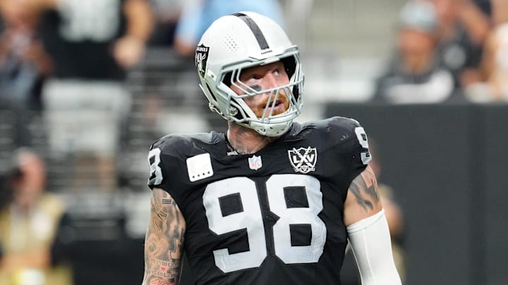 Sep 22, 2024; Paradise, Nevada, USA; Las Vegas Raiders defensive end Maxx Crosby (98) celebrates after getting a sack against the Carolina Panthers during the second quarter at Allegiant Stadium. Mandatory Credit: Stephen R. Sylvanie-Imagn Images