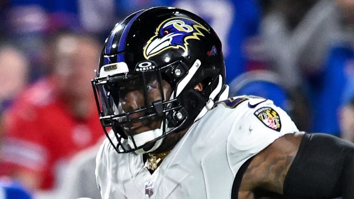 Sep 7, 2025; Orchard Park, New York, USA; Baltimore Ravens running back Derrick Henry (22) carries the ball in the second quarter against the Buffalo Bills at Highmark Stadium. Mandatory Credit: Mark Konezny-Imagn Images