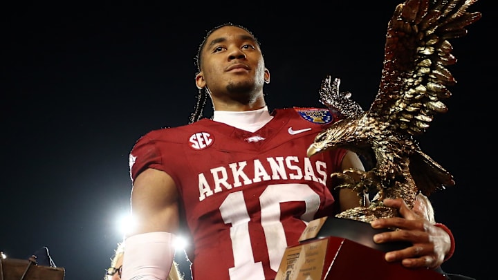Dec 27, 2024; Memphis, TN, USA; Arkansas Razorbacks quarterback Taylen Green (10) holds the AutoZone Liberty Bowl MVP trophy after defeating against the Texas Tech Red Raiders at Simmons Bank Liberty Stadium. Mandatory Credit: Petre Thomas-Imagn Images