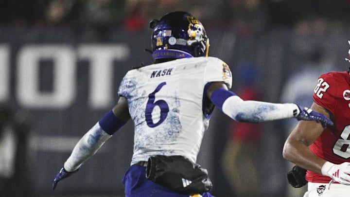 Dec 28, 2024; Annapolis, MD, USA; North Carolina State Wolfpack wide receiver Keenan Jackson (82) runs after a first half catch as East Carolina Pirates defensive back Dontavius Nash (6) defends during the Go Bowling Military Bowl at Navy-Marine Corps Memorial Stadium. Mandatory Credit: Tommy Gilligan-Imagn Images Dec 28, 2024; Annapolis, MD, USA; North Carolina State Wolfpack wide receiver Keenan Jackson (82) runs after a first half catch as East Carolina Pirates defensive back Dontavius Nash (6) defends during the Go Bowling Military Bowl at Navy-Marine Corps Memorial Stadium. Mandatory Credit: Tommy Gilligan-Imagn Images
