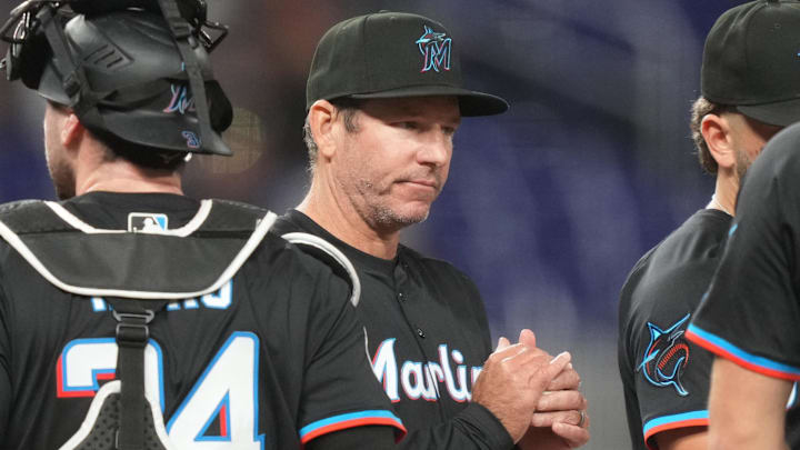 May 2, 2025; Miami, Florida, USA;  Miami Marlins manager Clayton McCullough (86) makes a pitching change in the fifth inning during the game against the Oakland Athletics at loanDepot Park. Mandatory Credit: Jim Rassol-Imagn Images