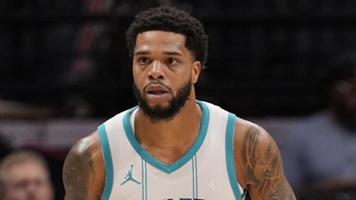 Nov 6, 2024; Charlotte, North Carolina, USA; Charlotte Hornets forward Miles Bridges (0) handles the ball against the Detroit Pistons during the first quarter at Spectrum Center. Mandatory Credit: Jim Dedmon-Imagn Images