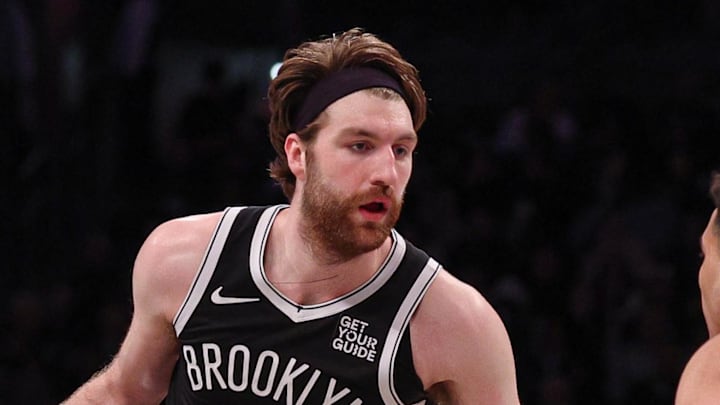 Apr 13, 2025; Brooklyn, New York, USA; Brooklyn Nets forward Drew Timme (26) is guarded by New York Knicks forward Kevin McCullar Jr. (9) during the second half at Barclays Center. Mandatory Credit: Vincent Carchietta-Imagn Images