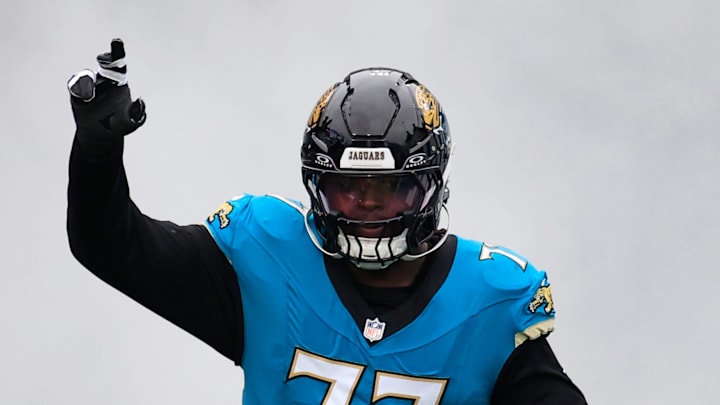 Jacksonville Jaguars offensive tackle Anton Harrison (77) runs on the field before an NFL football matchup at EverBank Stadium, Sunday, Jan. 4, 2026, in Jacksonville, Fla. The Jaguars defeated the Titans 41-7, capturing the AFC South title. Jacksonville Jaguars offensive tackle Anton Harrison (77) runs on the field before an NFL football matchup at EverBank Stadium, Sunday, Jan. 4, 2026, in Jacksonville, Fla. The Jaguars defeated the Titans 41-7, capturing the AFC South title.