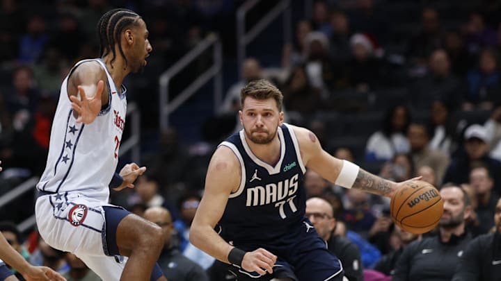 Dec 5, 2024; Washington, District of Columbia, USA; Dallas Mavericks guard Luka Doncic (77) dribbles the ball as Washington Wizards forward Alexandre Sarr (20) defends in the second quarter at Capital One Arena. Mandatory Credit: Geoff Burke-Imagn Images Dec 5, 2024; Washington, District of Columbia, USA; Dallas Mavericks guard Luka Doncic (77) dribbles the ball as Washington Wizards forward Alexandre Sarr (20) defends in the second quarter at Capital One Arena. Mandatory Credit: Geoff Burke-Imagn Images