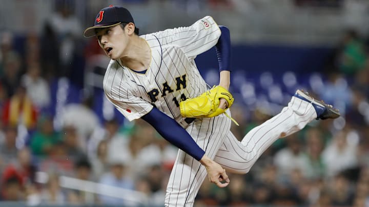 Mar 20, 2023; Miami, Florida, USA; Japan starting pitcher Roki Sasaki (14) delivers a pitch during the first inning against Mexico at LoanDepot Park