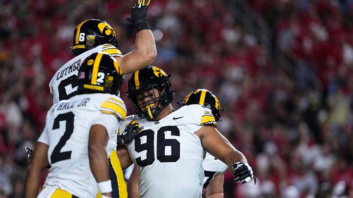 Oct 11, 2025; Madison, Wisconsin, USA; Iowa Hawkeyes defensive lineman Bryce Hawthorne (96) celebrates with teammates after intercepting a pass against the Wisconsin Badgers at Camp Randall Stadium. Mandatory Credit: Ross Harried-Imagn Images Oct 11, 2025; Madison, Wisconsin, USA; Iowa Hawkeyes defensive lineman Bryce Hawthorne (96) celebrates with teammates after intercepting a pass against the Wisconsin Badgers at Camp Randall Stadium. Mandatory Credit: Ross Harried-Imagn Images