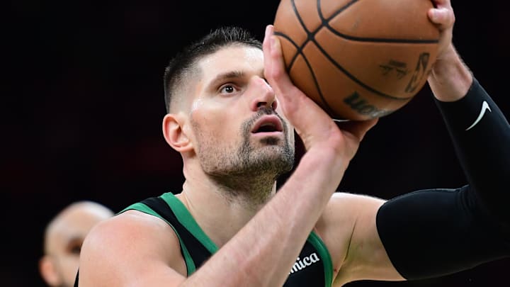 Feb 6, 2026; Boston, Massachusetts, USA;  Boston Celtics center Nikola Vucevic (4) shoots a free throw during the second half against the Miami Heat at TD Garden. Mandatory Credit: Bob DeChiara-Imagn Images