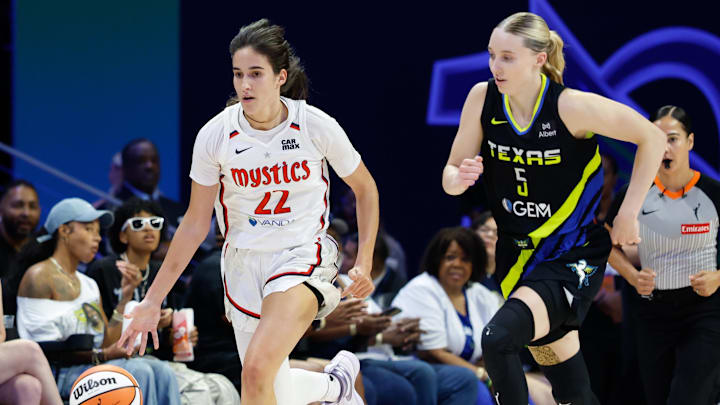 Aug 10, 2025; Arlington, Texas, USA; Washington Mystics guard Sonia Citron (22) dribbles upcourt ahead of Dallas Wings guard Paige Bueckers (5) during the first half at College Park Center. Mandatory Credit: Chris Jones-Imagn Images