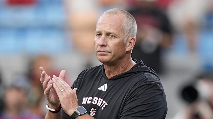 Sep 7, 2024; Charlotte, North Carolina, USA; North Carolina State Wolfpack head coach Dave Doeren during pregame activities against the Tennessee Volunteers at the Dukes Mayo Classic at Bank of America Stadium. Mandatory Credit: Jim Dedmon-Imagn Images