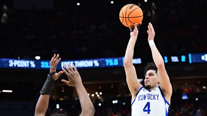 Mar 23, 2025; Milwaukee, WI, USA;  Kentucky Wildcats guard Koby Brea (4) shoots against Illinois Fighting Illini forward Morez Johnson Jr. (21) during the second half in the second round of the NCAA Tournament at Fiserv Forum. Mandatory Credit: Benny Sieu-Imagn Images