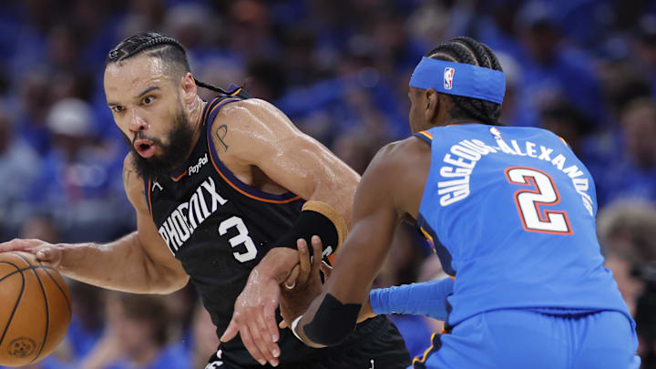 Apr 19, 2026; Oklahoma City, Oklahoma, USA; Phoenix Suns forward Dillon Brooks (3) drives around Oklahoma City Thunder guard Shai Gilgeous-Alexander (2) in the second quarter during game one of the first round of the 2026 NBA Playoffs at Paycom Center. Mandatory Credit: Alonzo Adams-Imagn Images