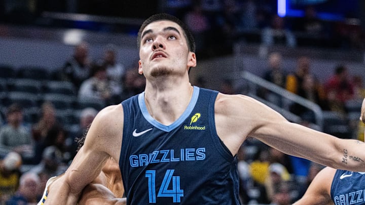 Oct 14, 2024; Indianapolis, Indiana, USA; Memphis Grizzlies center Zach Edey (14) boxes out Indiana Pacers forward Enrique Freeman (8) in the second half at Gainbridge Fieldhouse. Mandatory Credit: Trevor Ruszkowski-Imagn Images