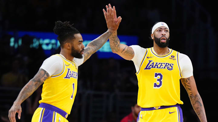 Mar 18, 2024; Los Angeles, California, USA; Los Angeles Lakers guard D'Angelo Russell (1) and forward Anthony Davis (3) celebrate against the Atlanta Hawks in the first half at Crypto.com Arena. Mandatory Credit: Kirby Lee-Imagn Images