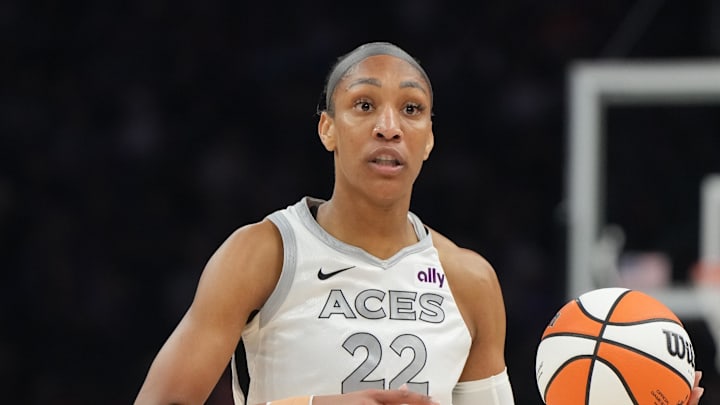 Aug 15, 2025; Phoenix, Arizona, USA; Las Vegas Aces center A'ja Wilson (22) brings the ball up court against the Phoenix Mercury in the first half at Footprint Center. Mandatory Credit: Rick Scuteri-Imagn Images