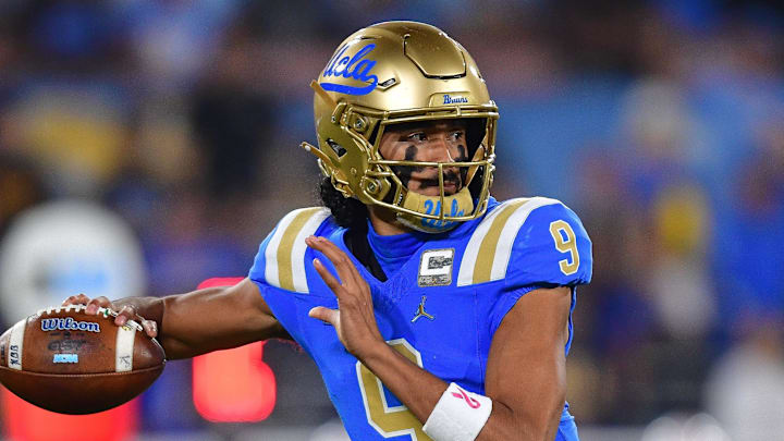 Nov 8, 2025; Pasadena, California, USA; UCLA Bruins quarterback Nico Iamaleava (9) throws against the Nebraska Cornhuskers during the first half at the Rose Bowl. Mandatory Credit: Gary A. Vasquez-Imagn Images