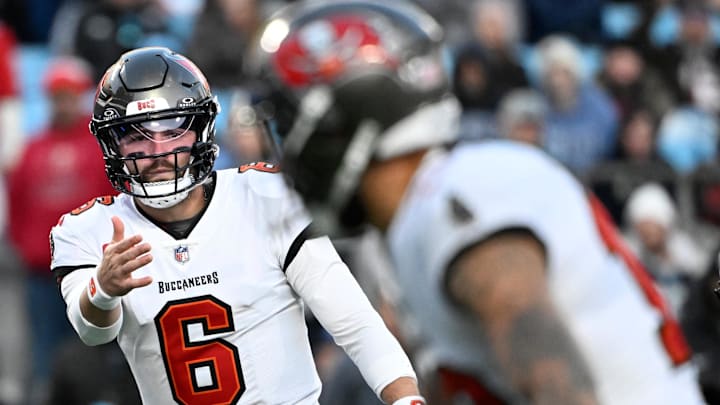 Dec 1, 2024; Charlotte, North Carolina, USA;  Tampa Bay Buccaneers quarterback Baker Mayfield (6) signals to wide receiver Mike Evans (13) in the first quarter at Bank of America Stadium. Mandatory Credit: Bob Donnan-Imagn Images