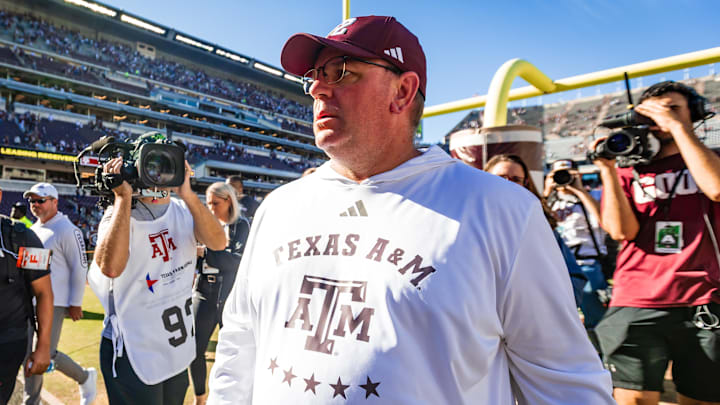 Texas A&M Aggies head coach Mike Elko walks off the field after defeating the Samford Bulldogs.