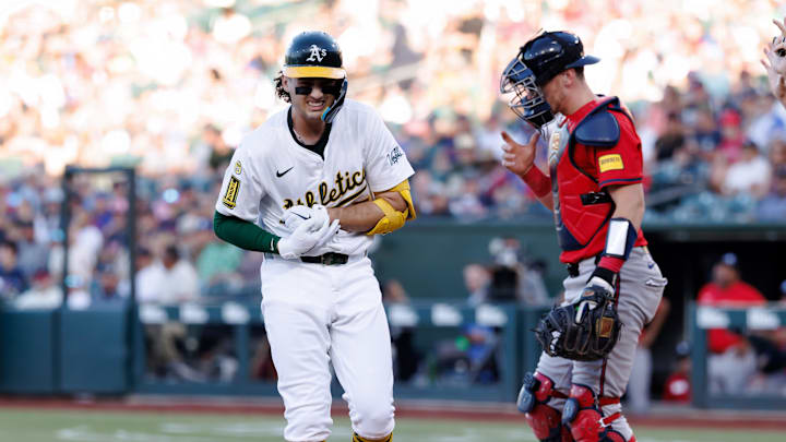 Jul 8, 2025; West Sacramento, California, USA; Athletics shortstop Jacob Wilson (5) reacts after getting hit by a pitch by Atlanta Braves starting pitcher Didier Fuentes (75) during the first inning at Sutter Health Park. Mandatory Credit: Sergio Estrada-Imagn Images