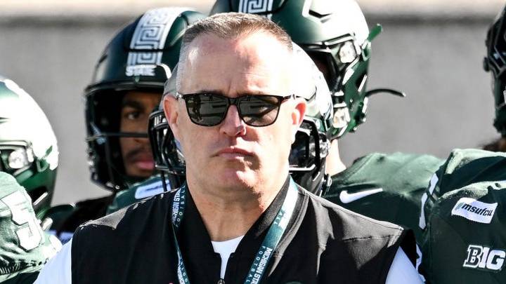 Michigan State’s head coach Pat Fitzgerald, center, is flanked by Nick Sharpe, left, and Ben Roberts as the team walks the end zone before the football game against Northwestern on Saturday, Oct. 17, 2026, at Spartan Stadium in East Lansing. Michigan State’s head coach Pat Fitzgerald, center, is flanked by Nick Sharpe, left, and Ben Roberts as the team walks the end zone before the football game against Northwestern on Saturday, Oct. 17, 2026, at Spartan Stadium in East Lansing.