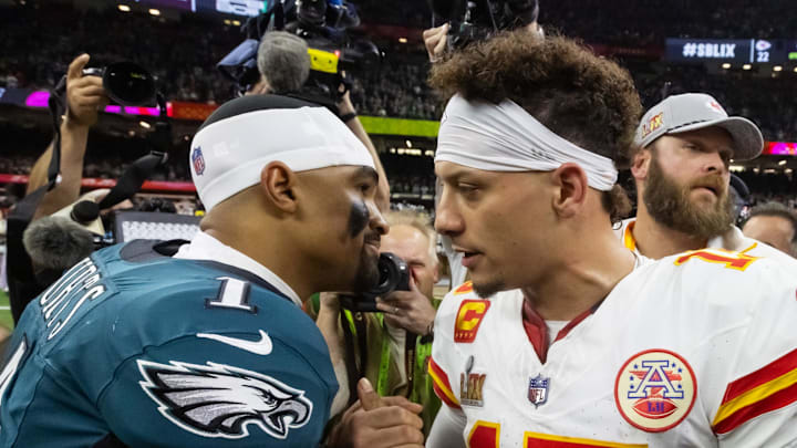 Feb 9, 2025; New Orleans, LA, USA; Philadelphia Eagles quarterback Jalen Hurts (1) greets Kansas City Chiefs quarterback Patrick Mahomes (15) following Super Bowl LIX at Ceasars Superdome. Mandatory Credit: Mark J. Rebilas-Imagn Images