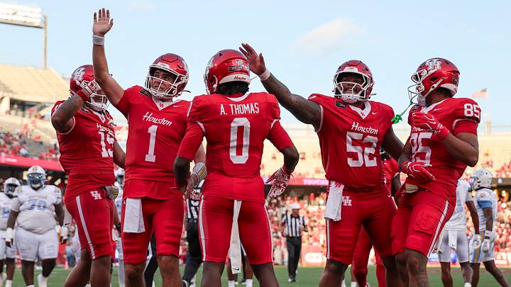 Sep 12, 2026; Houston, Texas, USA; Houston Cougars wide receiver Amare Thomas (0) celebrates and quarterback Conner Weigman (1) waves to the crowd after a touchdown during the first quarter against the Southern University Jaguars at TDECU Stadium. Mandatory Credit: Troy Taormina-Imagn Images Sep 12, 2026; Houston, Texas, USA; Houston Cougars wide receiver Amare Thomas (0) celebrates and quarterback Conner Weigman (1) waves to the crowd after a touchdown during the first quarter against the Southern University Jaguars at TDECU Stadium. Mandatory Credit: Troy Taormina-Imagn Images