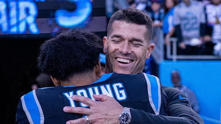 Nov 3, 2024; Charlotte, North Carolina, USA; Carolina Panthers head coach Dave Canales hugs quarterback Bryce Young (9) after getting the win against the New Orleans Saints at Bank of America Stadium. Mandatory Credit: Scott Kinser-Imagn Images