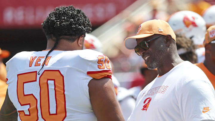 Tampa Bay Buccaneers head coach Todd Bowles and defensive tackle Vita Vea (50) talk prior to the game at Raymond James Stadium. 