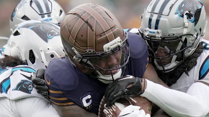 Green Bay Packers running back Josh Jacobs carries Carolina Panthers defenders.