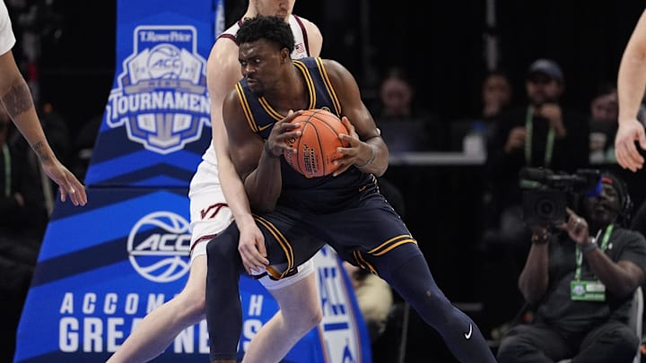 Mar 11, 2025; Charlotte, NC, USA; Virginia Tech Hokies center Patrick Wessler (5) defends under the basket against California Golden Bears center Mady Sissoko (12) during OT at Spectrum Center. Mandatory Credit: Jim Dedmon-Imagn Images