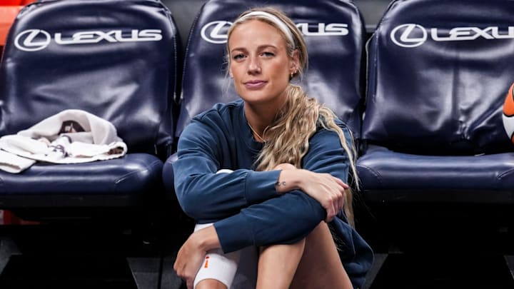 Indiana Fever guard Sophie Cunningham (8) sits on the sideline Thursday, April 30, 2026, during a preseason game between the Indiana Fever and the Dallas Wings at Gainbridge Fieldhouse in Indianapolis.