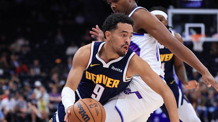 Oct 6, 2026; Salt Lake City, Utah, USA;  Denver Nuggets guard Ryan Nembhard (9) drives against Utah Jazz forward Harrison Ingram (00) during the second half at Delta Center.  Mandatory Credit: Rob Gray-Imagn Images