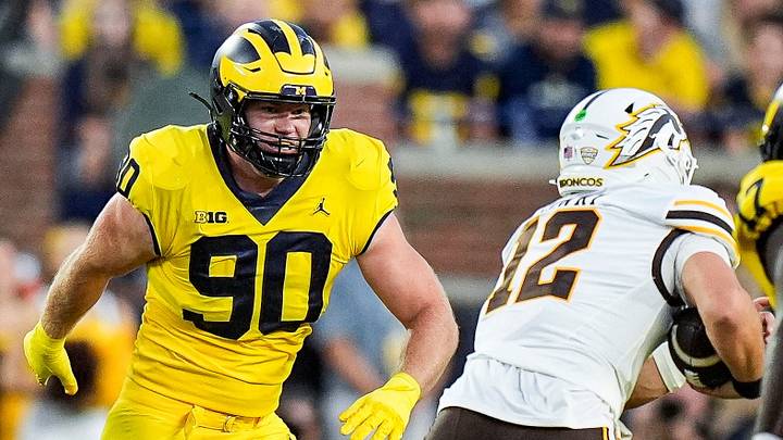 Michigan defensive end John Henry Daley (90) pressures Western Michigan quarterback Broc Lowry (12) during the first half at Michigan Stadium in Ann Arbor on Saturday, Sept. 5, 2026.