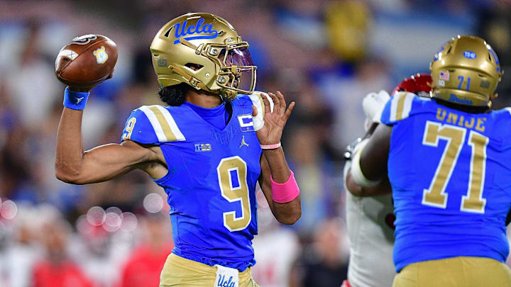 Aug 30, 2025; Pasadena, California, USA; UCLA Bruins quarterback Nico Iamaleava (9) throws against the Utah Utes during the second half at Rose Bowl. Mandatory Credit: Gary A. Vasquez-Imagn Images