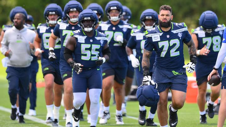 Seattle Seahawks offensive tackle Abraham Lucas leads a group in a jog during minicamp at Virginia Mason Athletic Center.