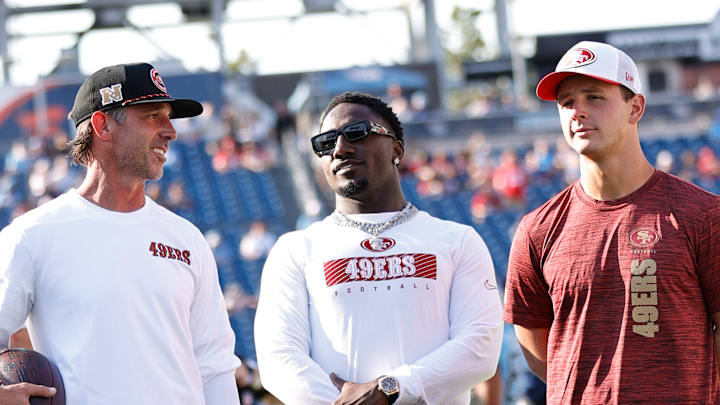 San Francisco 49ers head coach Kyle Shanahan (L), wide receiver Deebo Samuel (C) and quarterback Brock Purdy (R)