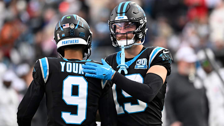 Nov 24, 2024; Charlotte, North Carolina, USA; Carolina Panthers quarterback Bryce Young (9) with wide receiver Adam Thielen (19) on the field in the fourth quarter at Bank of America Stadium. Mandatory Credit: Bob Donnan-Imagn Images