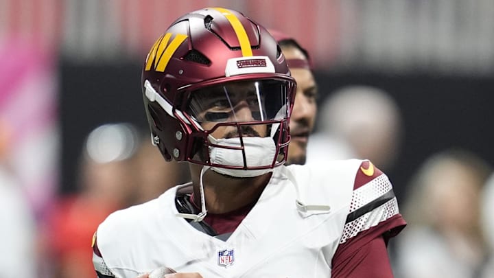 Washington Commanders quarterback Marcus Mariota warms up before a game against the Atlanta Falcons.