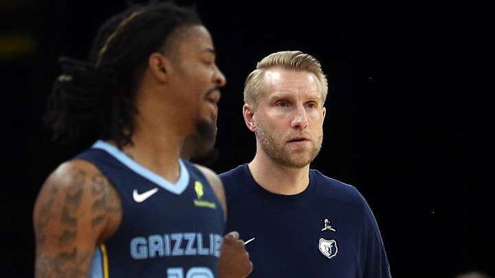Nov 3, 2025; Memphis, Tennessee, USA; Memphis Grizzlies head coach Tuomas Iisalo looks on as guard Ja Morant (12) checks into the game during the second quarter against the Detroit Pistons at FedExForum. Mandatory Credit: Petre Thomas-Imagn Images