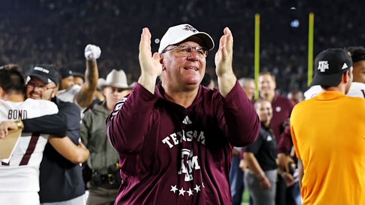 Sep 13, 2025; South Bend, Indiana, USA; Texas A&M Aggies head coach Mike Elko celebrates after the game against Notre Dame Fighting Irish at Notre Dame Stadium. Mandatory Credit: Trevor Ruszkowski-Imagn Images