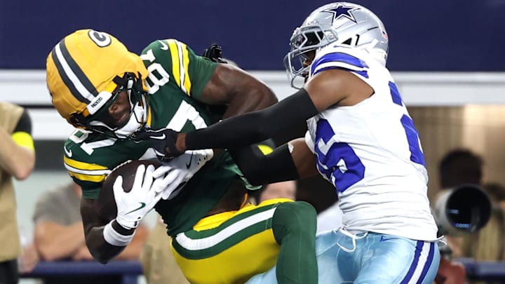 Green Bay Packers receiver Romeo Doubs (87) makes a catch for a touchdown against Dallas Cowboys cornerback DaRon Bland. Green Bay Packers receiver Romeo Doubs (87) makes a catch for a touchdown against Dallas Cowboys cornerback DaRon Bland.