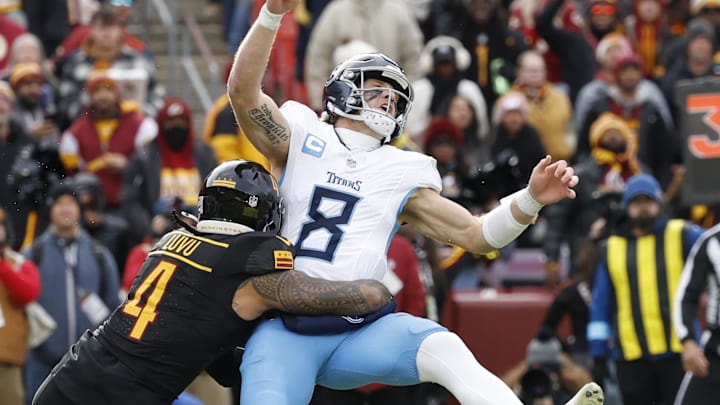 Dec 1, 2024; Landover, Maryland, USA; Tennessee Titans quarterback Will Levis (8) is hit while passing the ball by Washington Commanders linebacker Frankie Luvu (4) during the first quarter at Northwest Stadium. Mandatory Credit: Geoff Burke-Imagn Images Dec 1, 2024; Landover, Maryland, USA; Tennessee Titans quarterback Will Levis (8) is hit while passing the ball by Washington Commanders linebacker Frankie Luvu (4) during the first quarter at Northwest Stadium. Mandatory Credit: Geoff Burke-Imagn Images