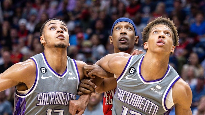 Apr 4, 2023; New Orleans, Louisiana, USA;  Sacramento Kings forward Keegan Murray (13) and forward Kessler Edwards hold back New Orleans Pelicans guard Josh Richardson (2) on a rebound during the second half at Smoothie King Center. Mandatory Credit: Stephen Lew-Imagn Images