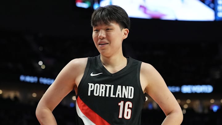 Feb 7, 2026; Portland, Oregon, USA; Portland Trail Blazers center Yang Hansen (16) reacts to a call during the first half against the Memphis Grizzlies at Moda Center. Mandatory Credit: Soobum Im-Imagn Images