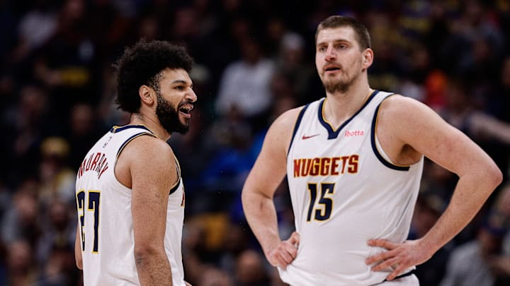 Feb 10, 2025; Denver, Colorado, USA; Denver Nuggets guard Jamal Murray (27) reacts after a call as center Nikola Jokic (15) looks on in the third quarter against the Portland Trail Blazers at Ball Arena.