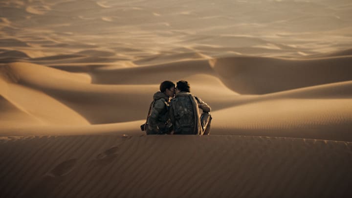 (L-r) ZENDAYA as Chani and TIMOTHÉE CHALAMET as Paul Atreides. in Warner Bros. Pictures and Legendary Pictures’ action adventure “DUNE: PART TWO,” a Warner Bros. Pictures release. Photo Credit: Courtesy Warner Bros. Pictures © 2023 Warner Bros. Entertainment Inc. All Rights Reserved.